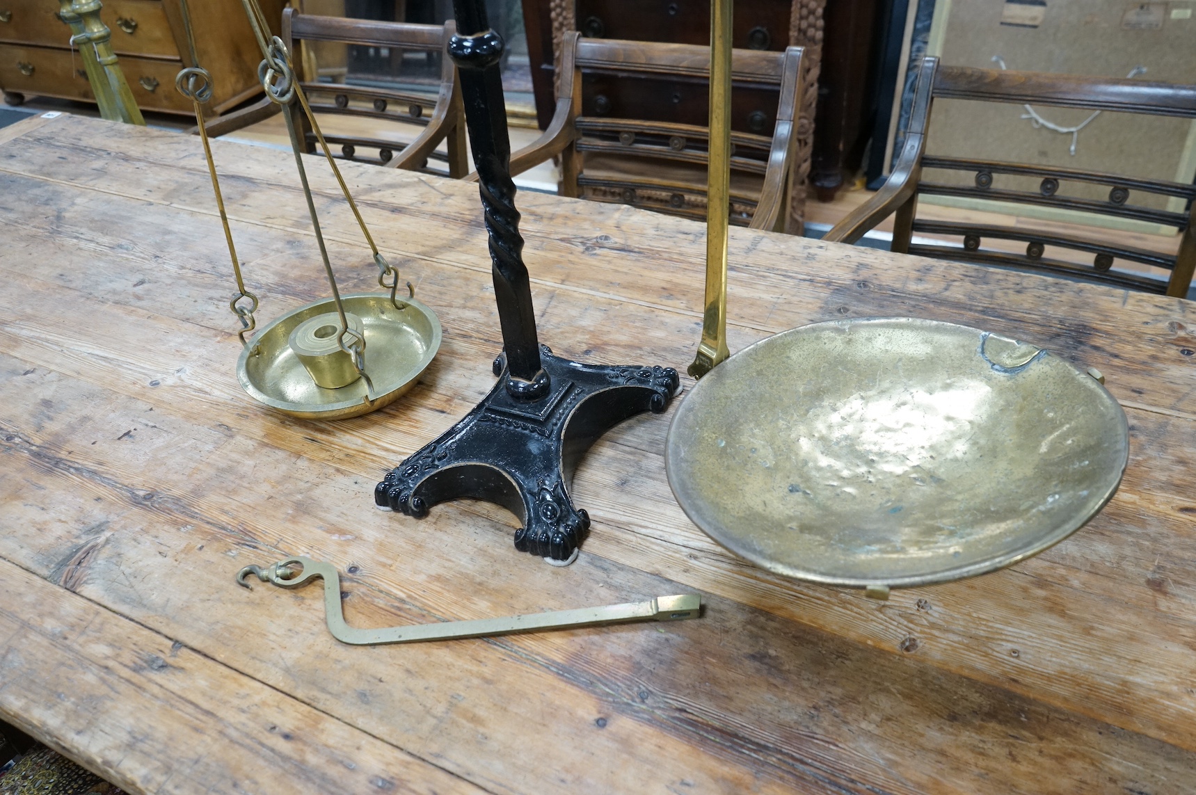 A brass Beam scale, on cast iron stand, W & T Avery, 95cm high. Condition - fair